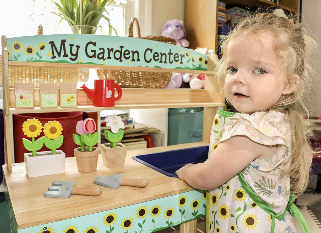 Bloom & Grow Gardening Center Wooden Toy Indoor Playset- 22 Pc Garden Stand Set w Flowers, Seed Packet, Pots Shovel Rake Apron Watering Pot- Interactive Fun Pretend Playtime Activity, Kids Summer Gift