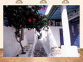 20x10ft Fabric Mykonos Greece Narrow Alley with Hibiscus Vine and Blue Doors Backdrop Artistic Floral Background for Summer Themed Party Decorations Home Wall Hanging Tapestry Photo Booth Props